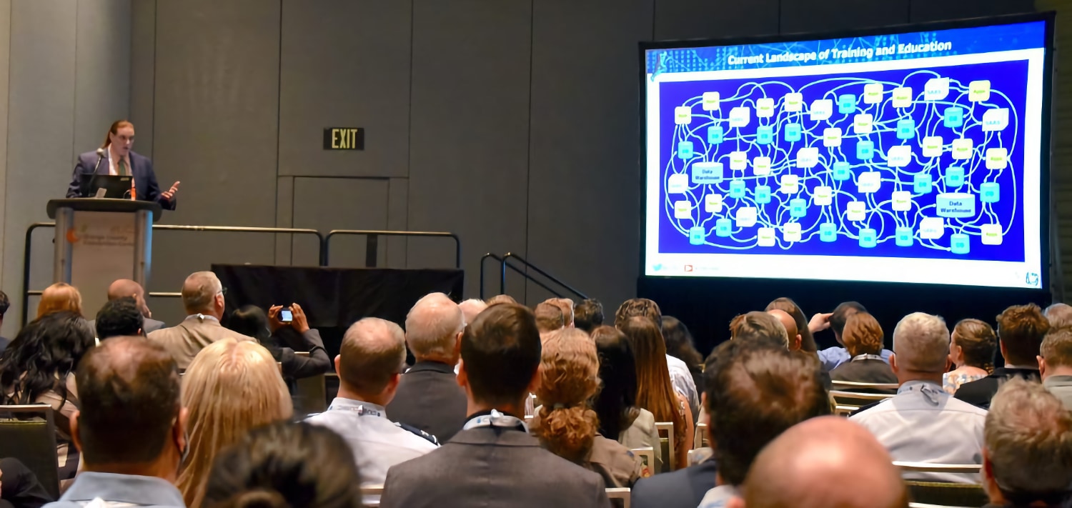 Photo of Brent Smith presenting at IITSEC